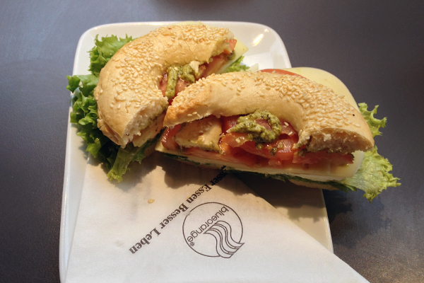 Italien bagel with tomato, mozzarella, and pesto